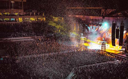 KISS performs behind a blast of white confetti at Chicago Open Air