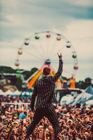 Monster Energy Carolina Rebellion daytime crowd, as seen from the stage, with ferris wheel in the background