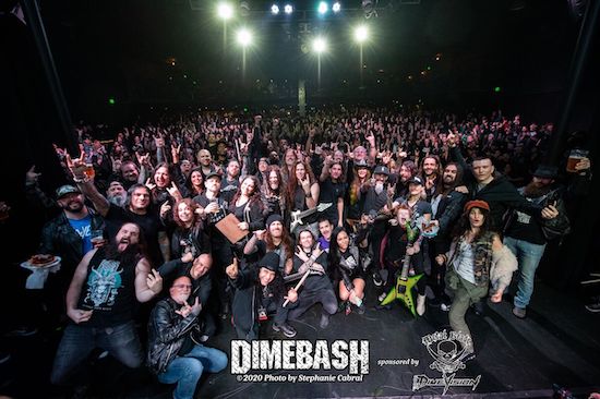 Dimebash musicians and crowd posing for a group photo at the end of the night