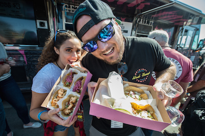 Sabroso attendees show off their tacos