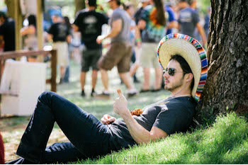 Sombrero-clad Sabroso guest relaxes under the shade of a tree