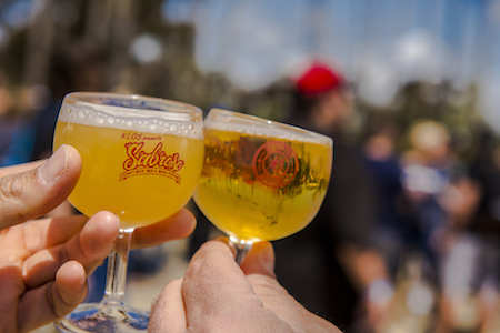 Raising a toast with craft beer samples at KLOS Sabroso Craft Beer, Taco & Music Festival 2017