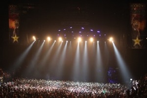 Rockstar Main Stage photo by Strati Hovartos A row of overhead stage spotlights shining down on a packed house in front of the Rockstar Main Stage at the Rockstar Energy Drink UPROAR Festival. Photo by Strati Hovartos.