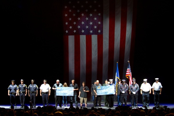 UPROAR 9/11 check presentation (photo by Justin Libano)