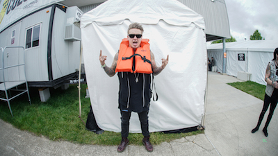 Jacoby Shaddix of Papa Roach poses with lifejacket for the Life Looks Good On You campaign