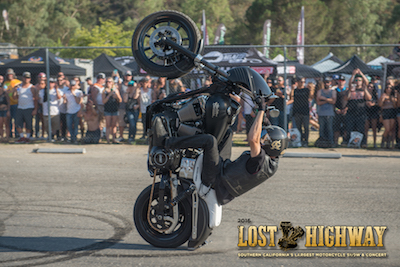 Stunt rider doing a wheelie at Lost Highway
