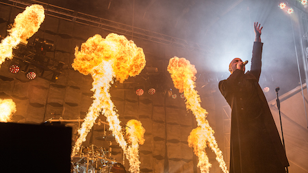 Flames shoot up behind Disturbed singer David Draiman at LOUDER THAN LIFE, photo by Andrew FOre
