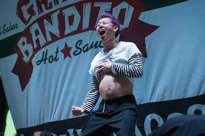 World champion eater Takeru Kobayashi shows off his taco-filled stomach after winning the 7th Annual Gringo Bandito Chronic Tacos Challenge