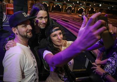 Alter Bridge's Myles Kennedy posing for a selfie with fans on ShipRocked 2017